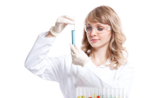 woman with a test tube performing lab tests