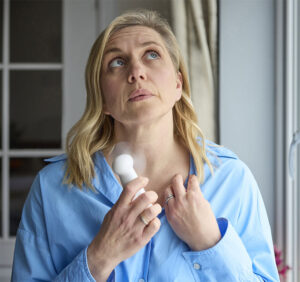 woman in perimenopause having a hot flash