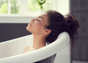 woman taking a bath to soothe a fibromyalgia flare