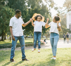 happy healthy family in a field