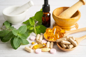 Herbs and plants with pills, alternative medicine concept