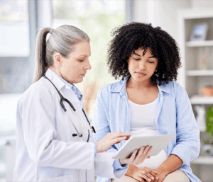 Doctor going over lab results with a PCOS patient